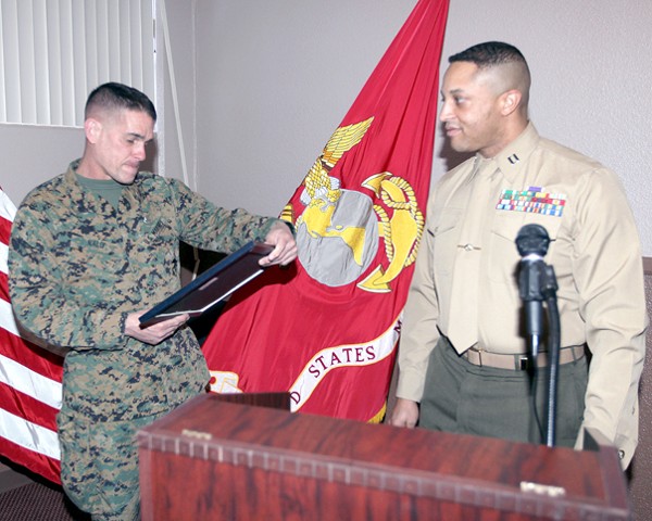 Capt. Marc N. Shelton, USMC (r), chapter president, presents Brig. Gen. Kevin J. Nally, USMC, director, command, control, communications and computers, and chief information officer of the Marine Corps, with a token of appreciation for his highly informative brief at the February luncheon.